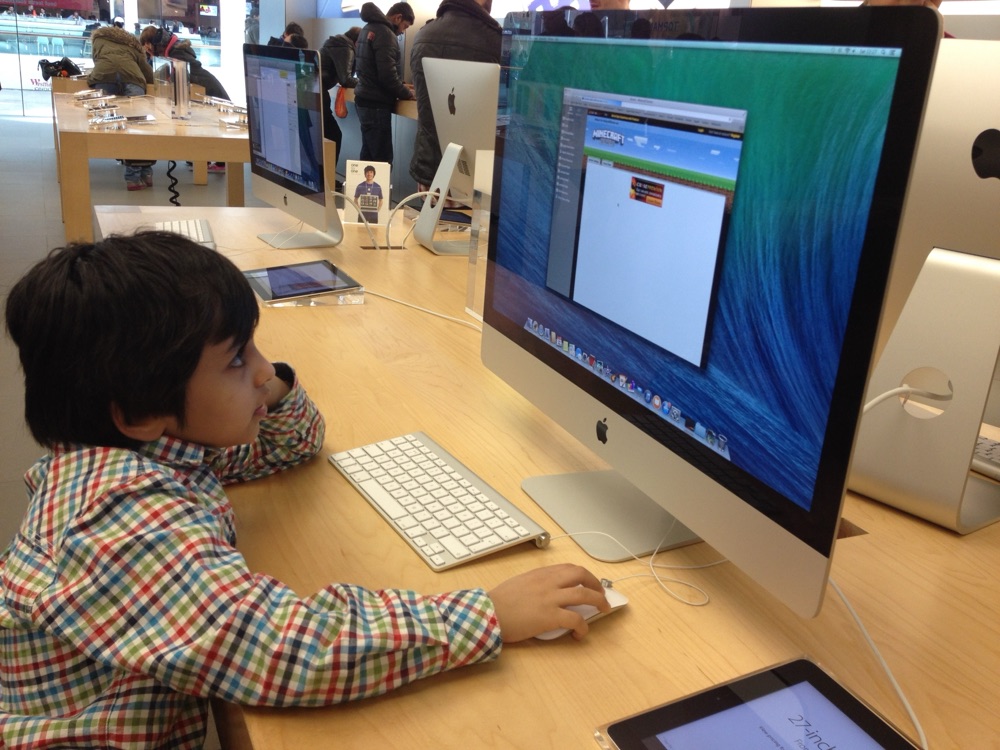 Muhammad aged five at an iMac